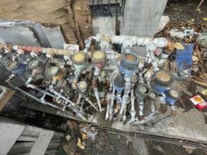 Infrastructure, water pipes and water meters of various houses, San Carlos, Negros Occidental,