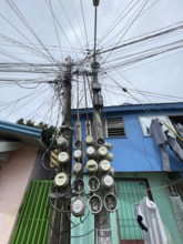 Infrastructure, energy supply, electricity, power lines, electricity meters of various houses, San