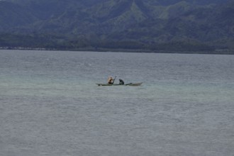 Two fishermen fishing off the coast, Negros Occidental, Philippines