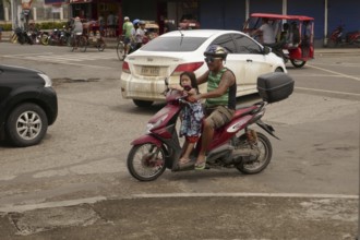 Man with moped and small daughter, Transport, Mobility, Negros Occidental, Philippines