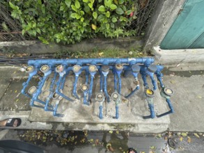 Infrastructure, water pipes and water meters of various houses, San Carlos, Negros Occidental,