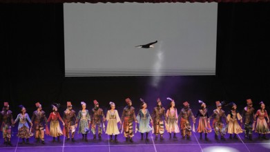 Members of Fire of Anatolia, also known as Anadolu Atesi, bow to the audience after their