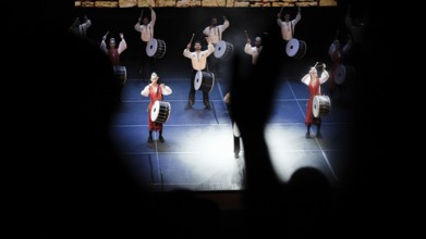 Dozens of members of Fire of Anatolia perform a drumming sequence during a cultural festival at