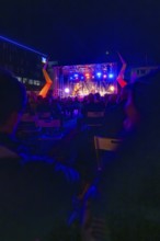 A night-time open-air concert with bright lights and a lively atmosphere, Sindelfingen, Böblingen