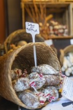 Basket of salami at a market stall with rustic products, Sindelfingen, Böblingen district, Germany