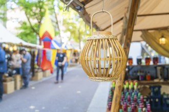 Decorative wooden lantern at a market with colourful stalls, Sindelfingen, Böblingen district,