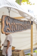 Wooden sign with lettering in front of a market stall, Sindelfingen, Böblingen district, Germany