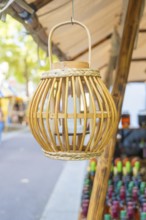 Wooden lantern hanging from a market stall with colourful bottles, Sindelfingen, Böblingen