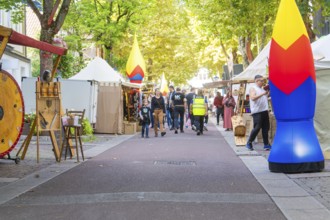 Lively market scene with people and stalls under trees, Sindelfingen, Böblingen district, Germany