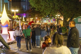 Lively street scene at night with many people and festive lighting, Sindelfingen, Böblingen