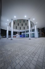 Modern architecture illuminated at night, focus on columns, Munich, Germany