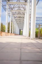 Colonnade with translucent structure and light-coloured floor, Munich, Germany