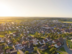 Aerial view of a village at sunset with densely built-up houses and rural flair, Althengstett,