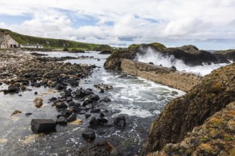 Breakwater at the fishing harbour, Ballintoy Harbour, Causeway Coastal Route, Antrim, Northern