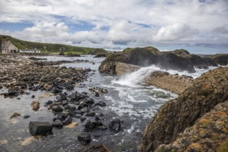 Breakwater at the fishing harbour, Ballintoy Harbour, Causeway Coastal Route, Antrim, Northern