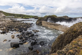 Breakwater at the fishing harbour, Ballintoy Harbour, Causeway Coastal Route, Antrim, Northern