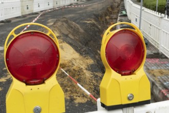 Borken, NRW, Germany, Red warning lights marking a construction site, ensuring safety with barrier
