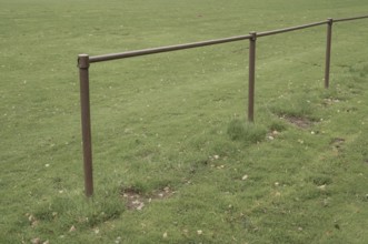 Borken, NRW, Germany, Metal railing boundary defining a sports field or park area