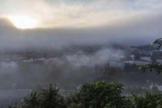 The city of Leoben in the early morning fog, Leoben, Styria, Austria