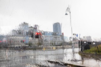 Raindrops on windscreen, red light from a traffic light, Dublin, Ireland