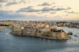 Beautiful sunset view of Valletta with Saint Angelo Fortress, capital city of Malta