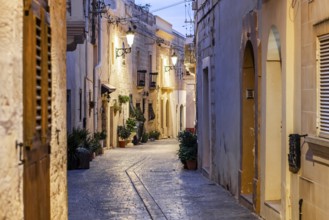 Charming illuminated medieval streets of Rabat Mdina in the evening Malta