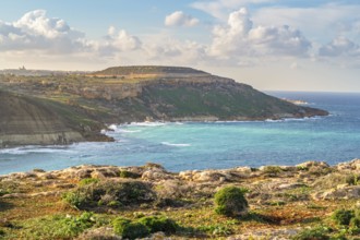 Beautiful view of Gozo coast seen from Ghar Mixta Cave, Malta