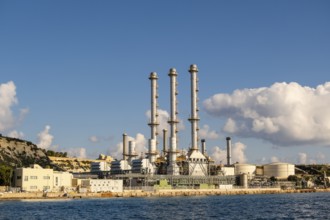Waterfront power station against blue sky, with copy space, near to Marsaxlokk, Malta