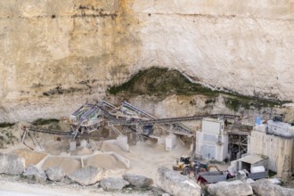 Limestone Quarry with Industrial Machinery in a Cliffside Setting in Malta