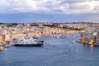Beautiful evening view of illuminated Valletta, Birgu with Saint Angelo Fortress, capital city of