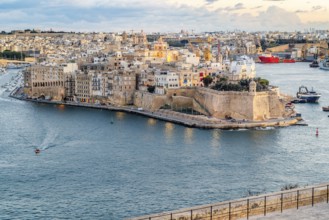 Beautiful sunset view of Valletta city with Saint Angelo Fortress, capital city of Malta