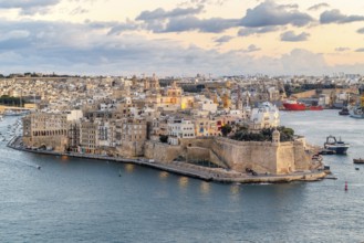 Beautiful sunset view of Valletta city with Saint Angelo Fortress, capital city of Malta