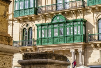Beautiful close up of wooden green historic windows in Valletta, Malta