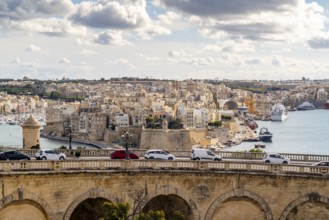 Beautiful view of bridge in capital city and historic architecture of Valletta, Malta