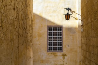 Street view with lantern and window in historic L-Imdina, Rabat, Malta