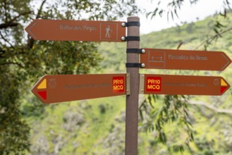 Brown information sign indicating different trails in Monchique area, Algarve, Portugal