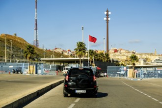 Fnideq, Morocco - December 26 2023: car passing country border between Morocco and Spain