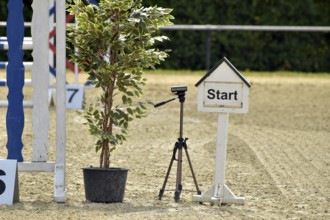 Starting area of a show jumping course with timing device at an equestrian event,
