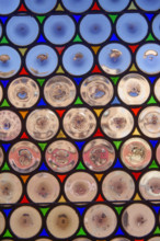 Antique window with round panes in Siena