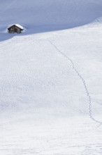 Footprints to a hut in the snow, Fiescheralp, Valais, Switzerland