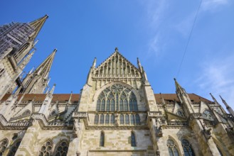 Imposing Gothic cathedral with striking towers under a clear sky, St Peter's Cathedral, Regensburg,