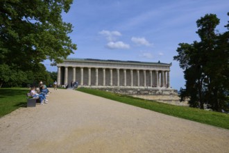 Building with columns in a green setting with walkers and trees, Walhalla, Donaustauf, Regensburg,