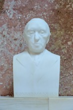 Serious marble bust of Konrad Adenauer, white marble against a red background, Walhalla,