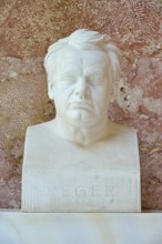 Serious marble bust of Max Reger against a red background, classical style, Walhalla, Donaustauf,