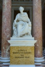 Marble statuette of Ludwig I in a sitting pose between red columns, Walhalla, Donaustauf,