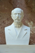 Marble bust of Max Planck with bow tie against a reddish background, Walhalla, Donaustauf,