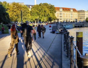 Strollers in Monbijoupark on the Spree, Berlin, Germany