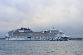 A cruise ship, MSC Euribia, the MSC on the sea under a cloudy sky, Heikendorf, Plön district, Kiel