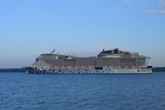 Cruise ship, MSC Euribia, sailing through the vastness of the ocean under a blue sky, Heikendorf,