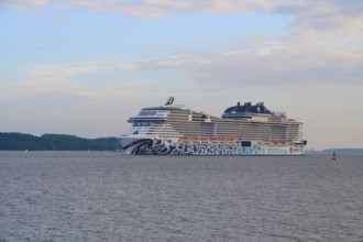 A cruise ship, MSC Euribia, sailing close to the coast across the calm sea, Heikendorf, Plön